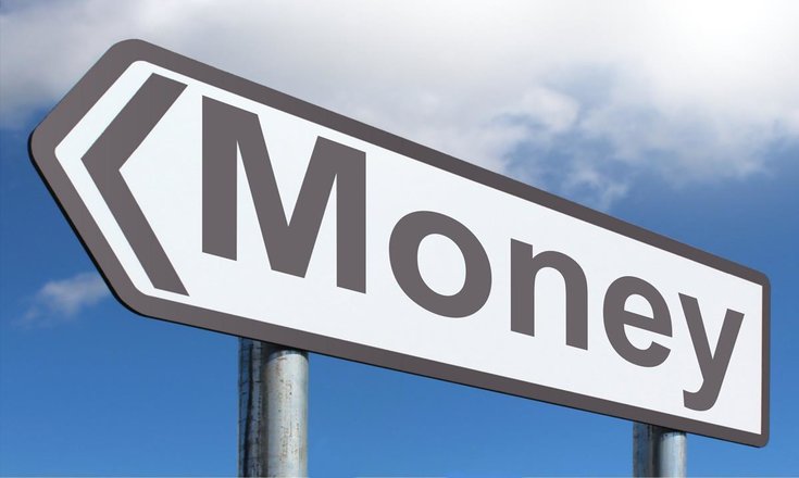 close-up of directional street sign that says 'money'