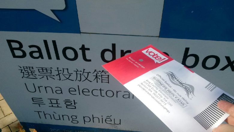 Ballot being put in drop box outside SCC campus