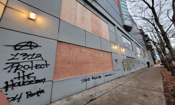 Nagle side of MAC building with tagging and boarded up windows