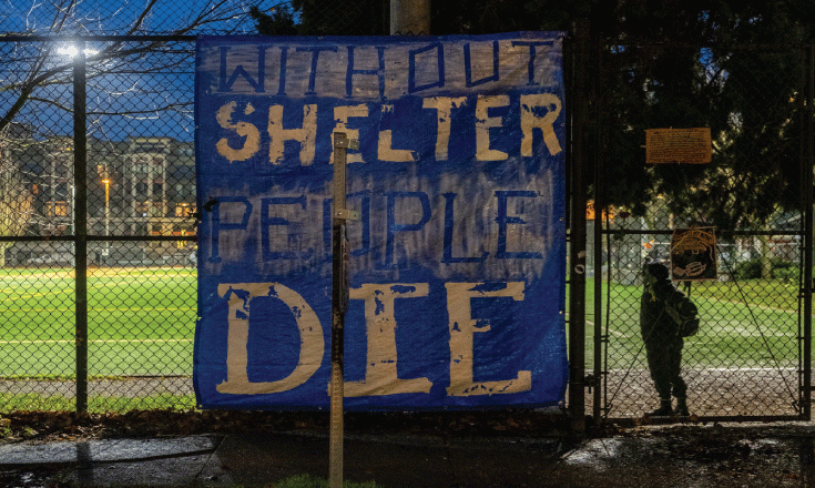 A shandmande sign reads "Without Shelter People Die"