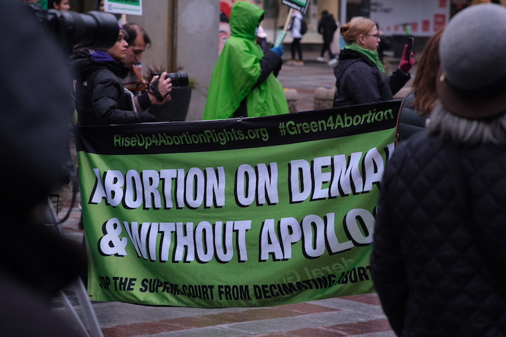 A Rise Up 4 Abortion Rights banner: “Abortion on demand & without apology.”
