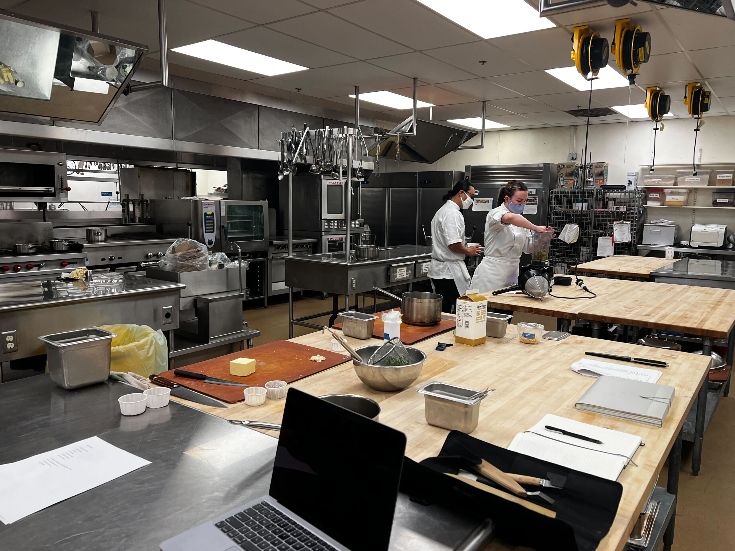 Culinary students busy with prepping ingredients