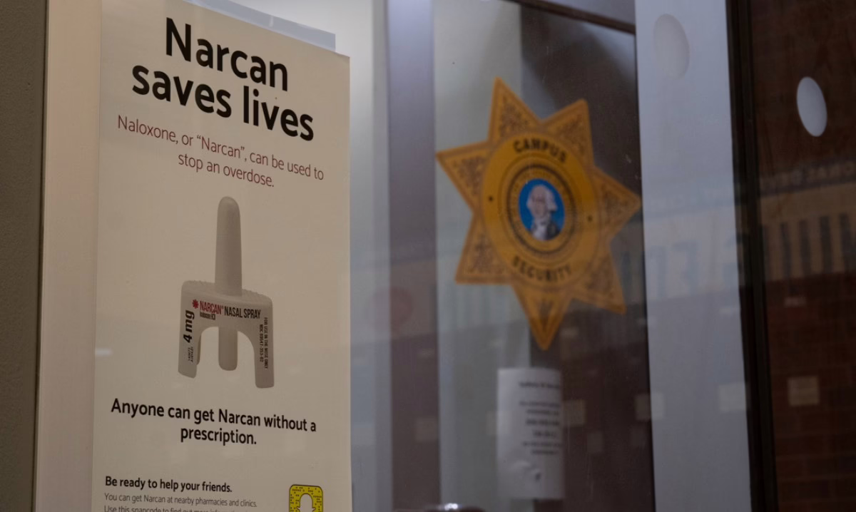 Narcan Saves Lives poster outside of Campus Security Office.
