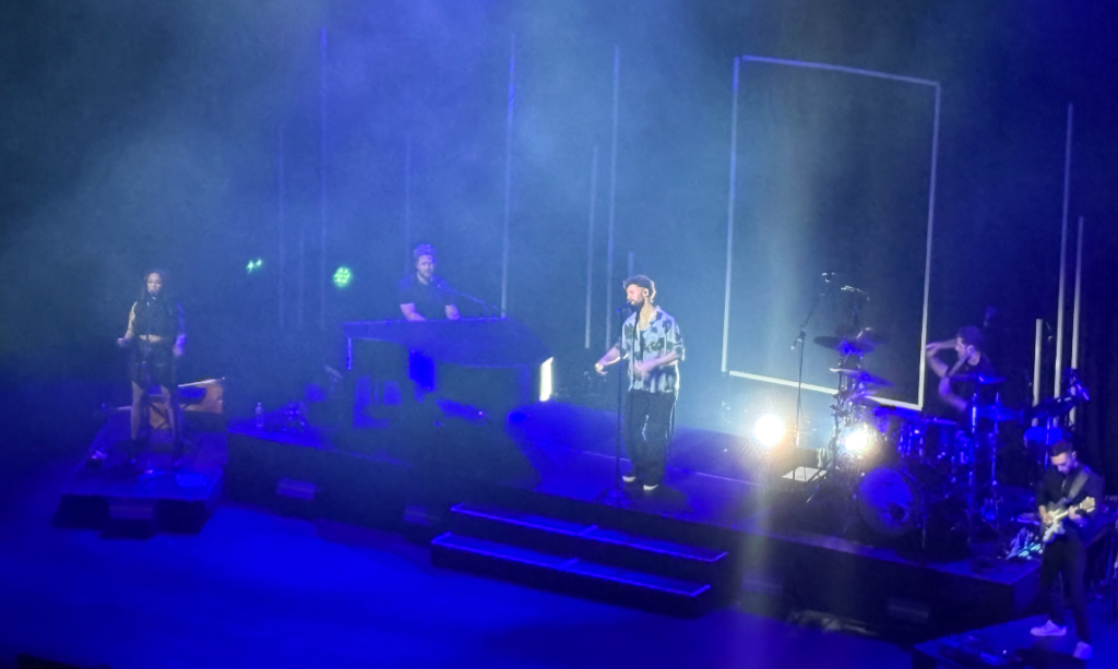 Calum Scott starting his setlist with his first album on stage