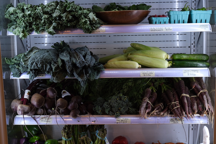 Vibrant hyperlocal produce available at The Naked Grocer.