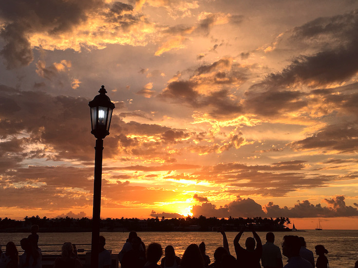 A sunset paints the sky at Mallory Square in Key West, FL.